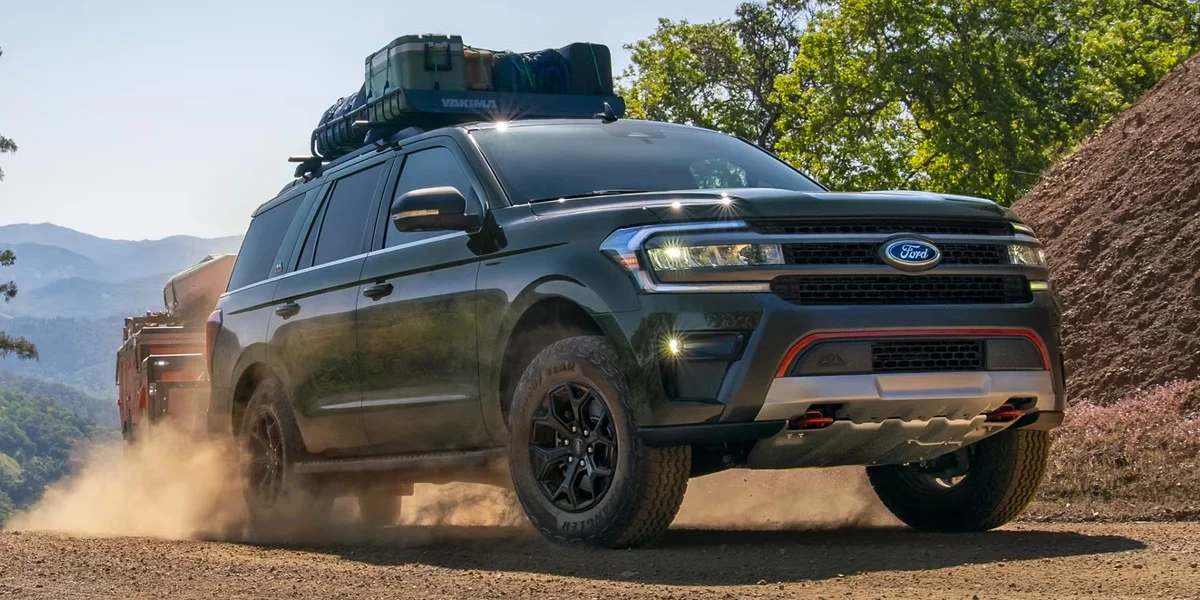 The 2024 Ford Expedition driving up a dusty wilderness trail