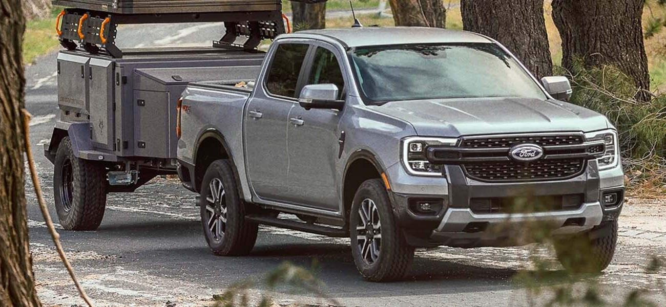 The 2025 Ford Ranger driving with a trailer attached