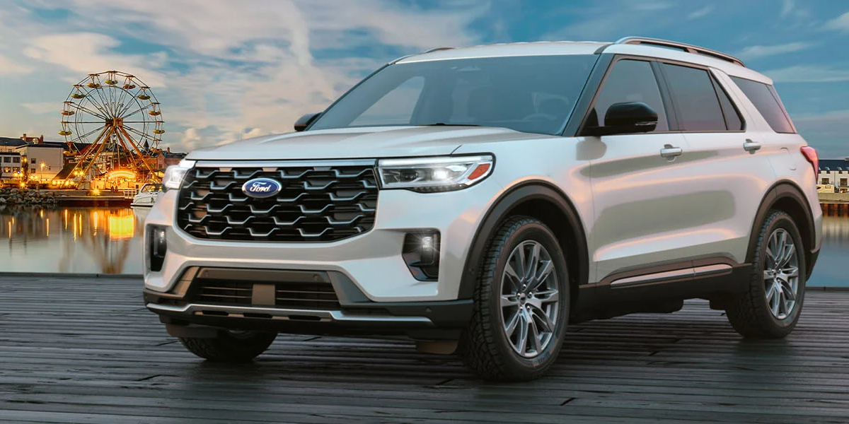 A 2025 Ford Explorer parked next to a boardwalk, complete with a Ferris Wheel