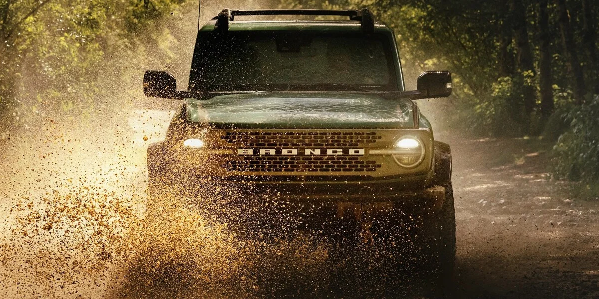 The 2025 Ford Bronco powering through the mud and dirt