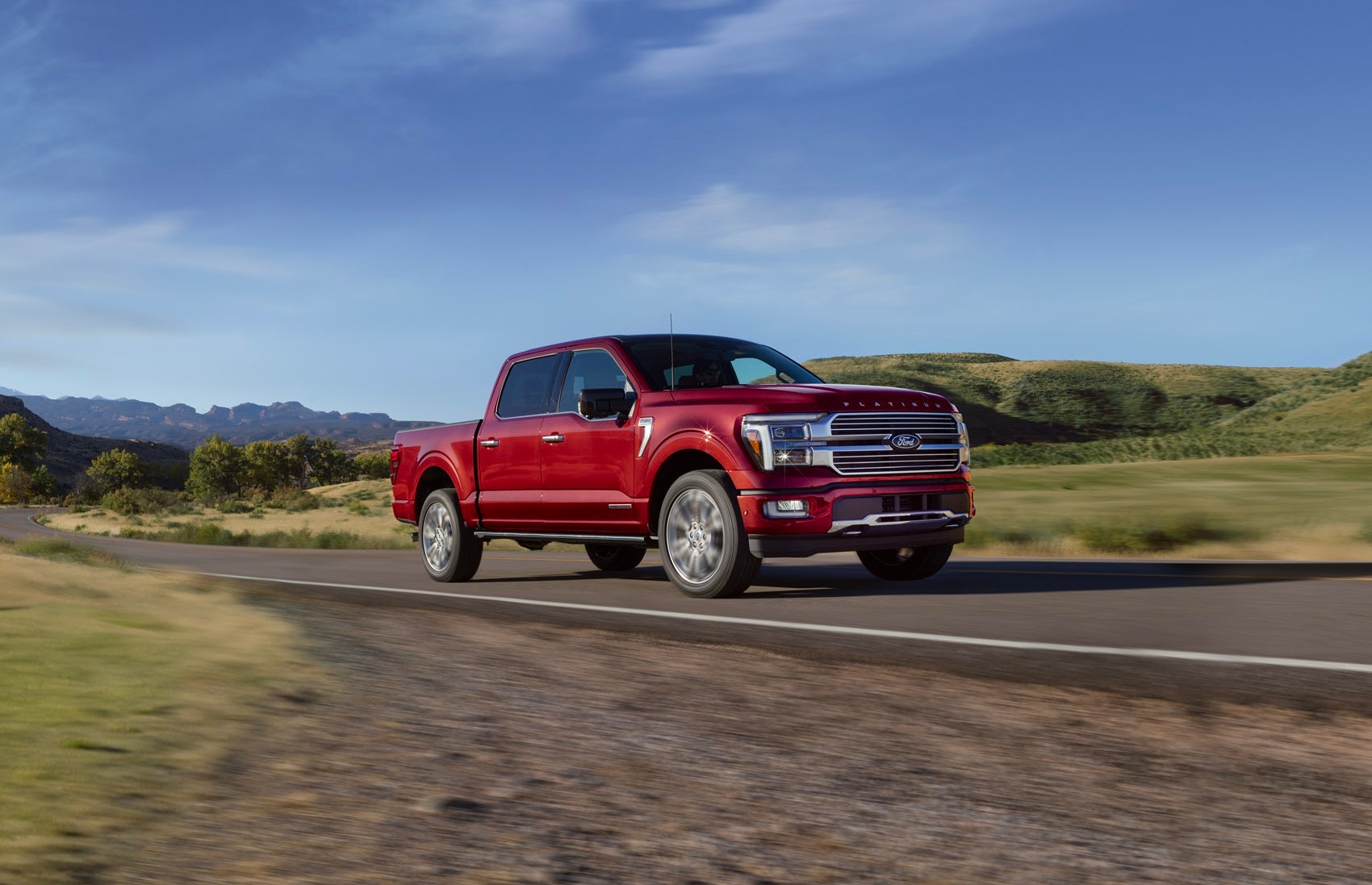 Red Ford luxury truck driving
