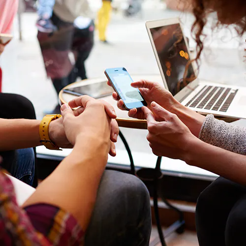 two people browsing a cellphone